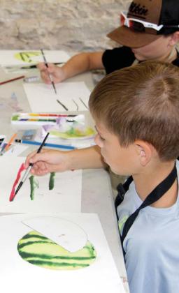 Art camp participants learn how to complete watercolor lines as part of the watermelon painting exercise. Wyndi Veigel-Gaudette | Citizen staff photo