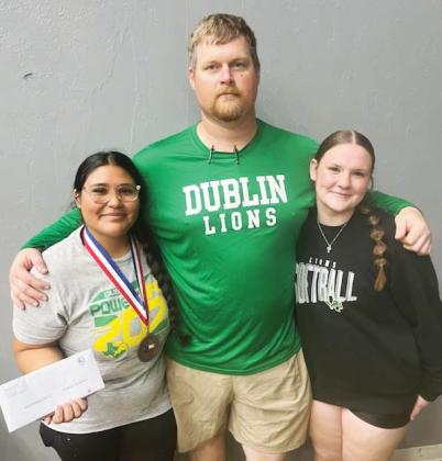 DHS head powerlifting coach poses with DHS state qualifiers Mariana Ortiz (left) and Cassidy Adair (right). | submitted photo
