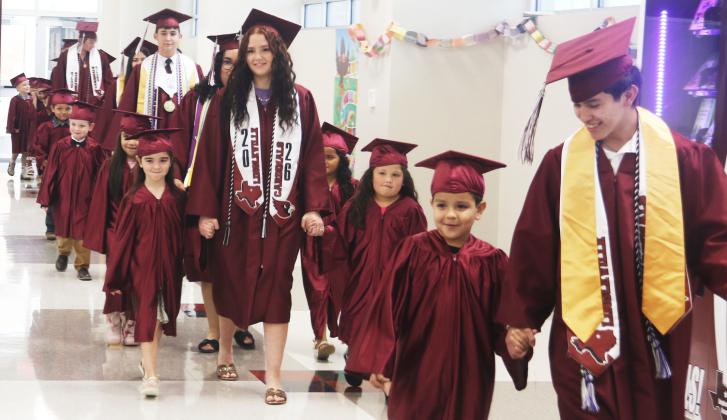 Lingleville seniors led kindergarten graduates through the cafeteria while other students wished them well during a special walk Wednesday, May 20. Wyndi Veigel-Gaudette | Citizen staff photo