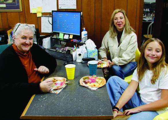 Chamber President Nancy Williams, Chamber Executive Director Rhonda Williams and Braylon Weems grab some lunch together at Walker Insurance Agency’s special reception Tuesday, Nov. 25.