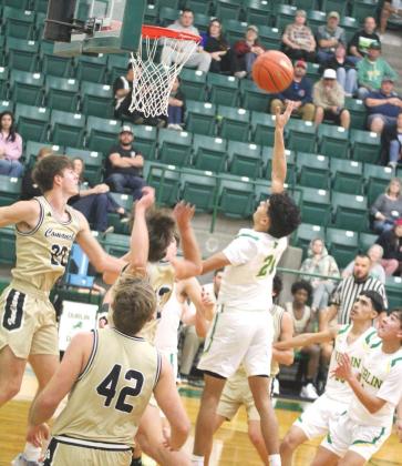 Dublin Lion Kaden Gaitan springs up and launches a 2-pointer over Comanche Indian defense during the Friday, Dec. 20 home game. The Lions won 80-59. Paul Gaudette | Citizen staff photo
