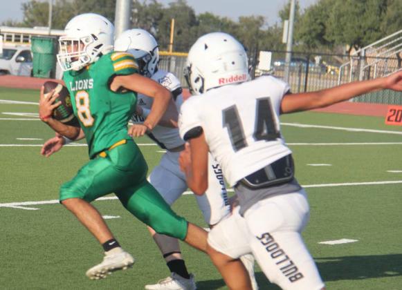 JV Lion Jacob Marret ducks Clyde Bulldog defense during a scrimmage on Cervetto Field Aug. 22. Paul Gaudette | Citizen staff photo