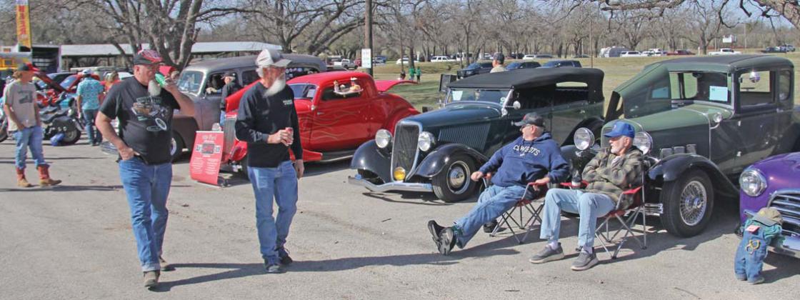 Spectators walk through the St. Patrick’s Day Car Show at the City Park Saturday, March 15 during the annual festival. Paul Gaudette | Citizen staff photo