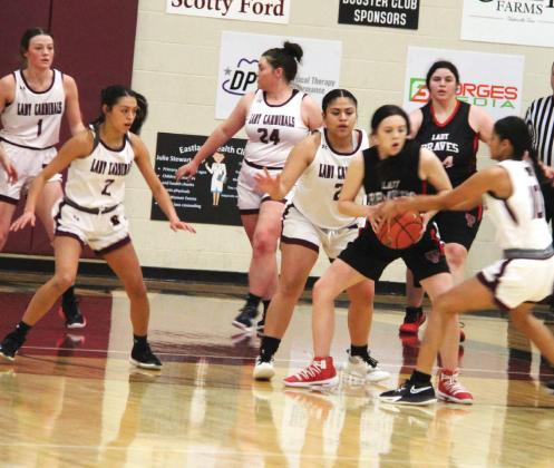 Lingleville Lady Cardinals battle with Three Way at the net during a Tuesday, Dec. 19 game on the Lingleville court. The Lady Cards took the win 50-11 raising their district record to 3-0. Paul Gaudette | Citizen staff photo