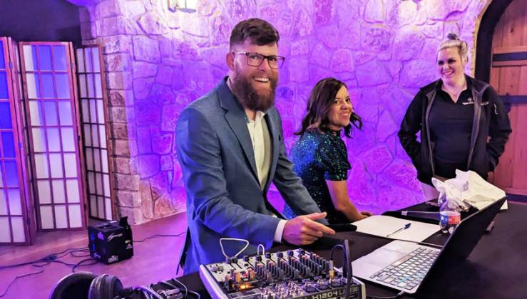 Lance Battenfield, owner of Lingleville Country Store and Blackjack’s, cranks out tunes as DJ at Lingleville’s prom. Paul Gaudette | Citizen staff photo