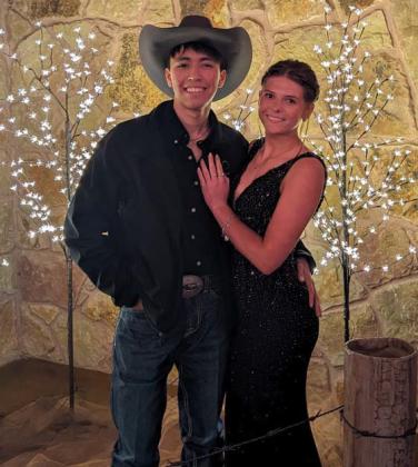 Students pose for photos together in front of a lit tree display at Lingleville’s prom at Bella Vita Ranch. Paul Gaudette | Citizen staff photo