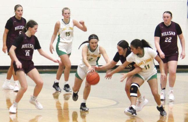 Lady Lions and Millsap Bulldogs vie for the ball under the net during the home game Friday, Jan. 26. Paul Gaudette | Citizen staff photo