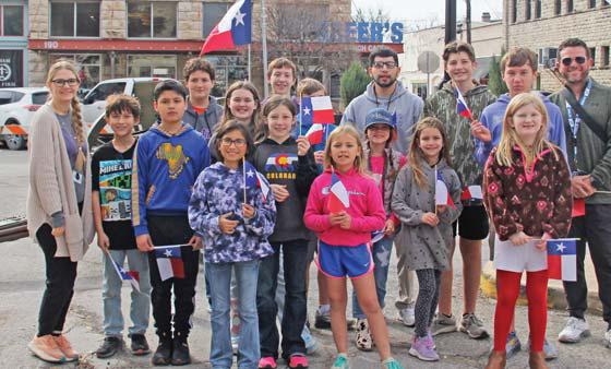 Students enjoy a first hand history lesson at the dedication of the Erath County Alamo letter.