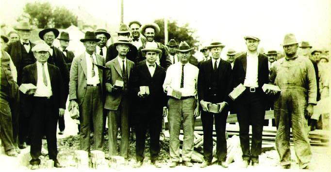 The city mayor and councilmen held brick during the groundbreaking for paving of downtown. It took place on May 12, 1926 at the corner of Live Oak and Patrick Street. Courtesy photo