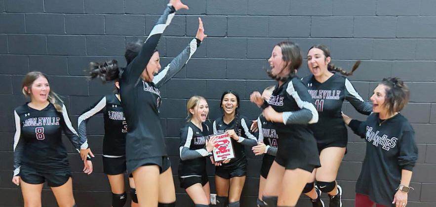 The Lingleville JV Lady Cardinals volleyball team and coach Lauren Wilson celebrate after claiming the top spot in the Strawn Tournament Friday, Aug. 16. The team only lost two sets in five games. Brandon Huaght | Submitted photo