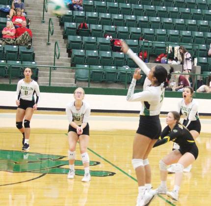 Lady Lion Ingrid Hernandez leaps up to return the ball against Hico Tigers in the Dublin Invitational Tournament on Thursday, Aug. 24 while teammates move in to assist. Paul Gaudette | Citizen staff photo