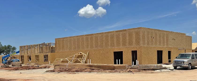 Work is progressing steadily at Comanche County Medical Center’s long-term care facility. At left, a crewman prepares for electrical installation on Section 1. Above is the exterior view of the southeast corner of the building where the kitchen and dining room will be housed. Below is a view looking north of Section 2 of Comanche County’s longterm care center which is nearly at construction “rough-in” phase. | submitted photos