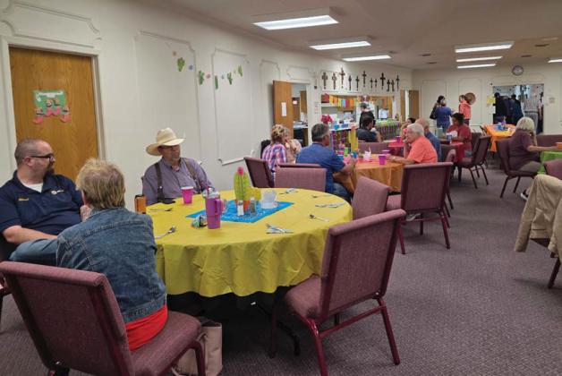Citizens enjoy chatting and eating tacos in honor of Cinco De Mayo at FBC Dublin. Wyndi Veigel-Gaudette | Citizen staff photo