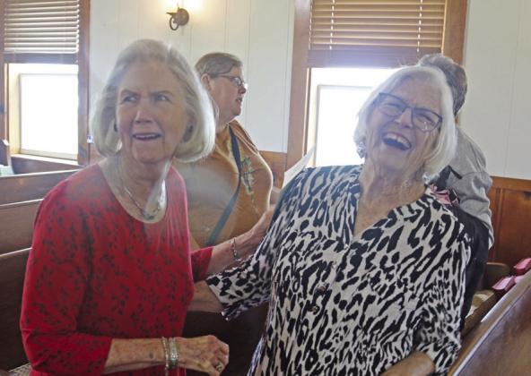 Sharron Kelso and Karen Pair West exchange laughs as they recall memories of attending Greens Creek Methodist as children. Paul Gaudette | Citizen staff photo