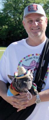 A french bulldog is quite stylish in his hat as he prepares to ride out the 5K run in a side satchel. For more photos of the event see The Dublin Citizen Facebook page. Paul Gaudette | Citizen staff photo
