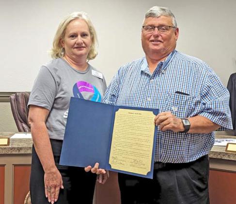 Laura Gambino, Executive Director of Cross Timbers Family Services, is presented a proclamation by Dublin Mayor David Leatherwood for in honor of National Crime Victim’s Rights Week April 21-27. 