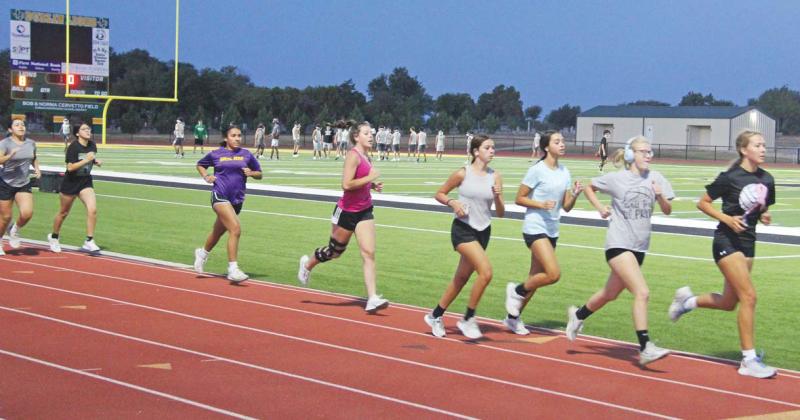 Paul Gaudette | Citizen staff photo Dublin Lady Lion volleyball players took to the track while DHS Lion football teams started honing skills on Cervetto Field as Two-A-Day practices began Monday.