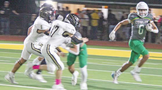 Dublin Lion Ayden Vargas sweeps left around Comanche defense while teammates block during the Oct. 20 home game. Paul Gaudette | Citizen staff photo