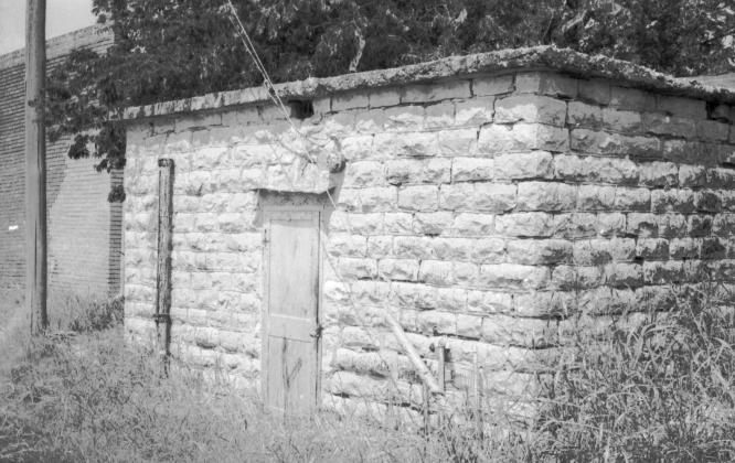 The Dublin calaboose was built in 1889 and may have been rebuilt or enlarged in 1898. Jails such as this were often used when drunkenness or rowdy behavior became a problem. The pathway between it and the local saloon and pool hall was used regularly.. | Dublin Historical Museum archive photo