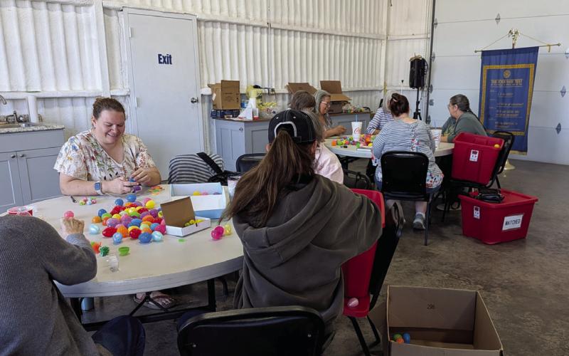 Volunteers help stuff thousands of Easter eggs at one of two Egg Stuffing Parties held in March at The Station. The annual hunt will have more than 17,000 eggs filled with candy, toys and other prizes. Paul Gaudette | Citizen staff photo