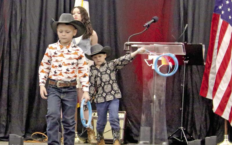 Wyndi Veigel-Gaudette and Paul Gaudette | Citizen staff photos Young cowboys model western wear from Rope Your Style in Early during the 9th annual Simply Dangerous event Saturday, Feb. 28. Below left, Golden Chick Managers Ryan Raborn (along with Marcia Raborn) receives Sponsor of the Year award from Lilly G Arena Productions. Below right, Dublin Dairy Queen Manager Shanna Phelps accepts the Top Hand Business award from Lilly G’s owner Rick Taylor.
