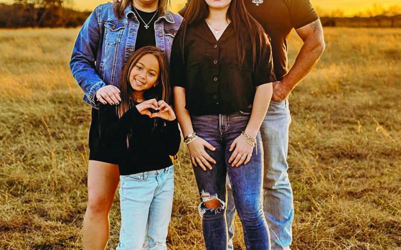 Derris Lueck, a 2010 graduate, enjoys her life working in her real estate business and sharing time with her husband Tyson, and daughters. Submitted photo