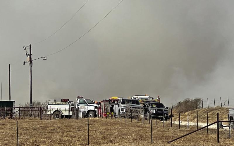 A group of first responders and neighbors work to extinguish a fire Saturday, Feb. 7. Kari Lanting | Courtesy photo