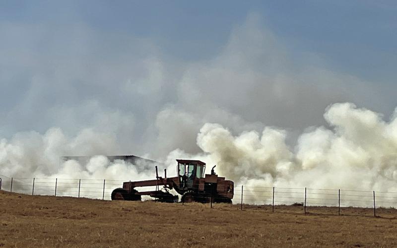 A dozer makes a fire break as a wildfire moves through land near Edna Hill. Kari Lanting | Courtesy photo