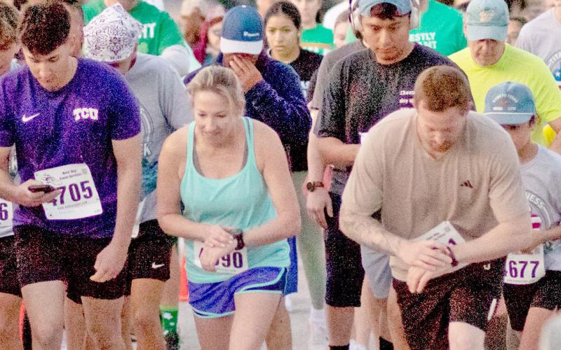 Runners don their lucky shirts as they participate in the annual Shamrock Shuffle hosted by Titan Fitness Saturday, March 14 in conjunction with the annual St. Patrick’s Day event. Danielle Meador | Citizen staff photos