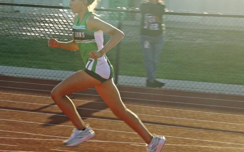 Dublin JV Lady Lion Tylor Nail rushes to a second place finish in the 800 meter run. Paul Gaudette | Citizen staff photo