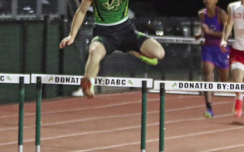 Paul Gaudette | Citizen staff photo Dublin JV Lion Brittain Barbier clears hurdles to a first place in the 300 meter at the Dublin Invitational Track Meet.