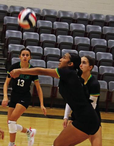 Dublin Lady Lion Ingrid Hernandez returns the ball during a tournament game Saturday, Sept. 13. Teammates Emma Mitchell and Regan Vanbebber stand by to assist. Paul Gaudette | Citizen staff photo