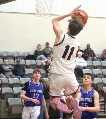 Lingleville Cardinal Jaxson Rives lifts up to shoot a 2-pointer as Walnut Springs opposition look on during the Jan. 3 home game. Paul Gaudette | Citizen staff photo
