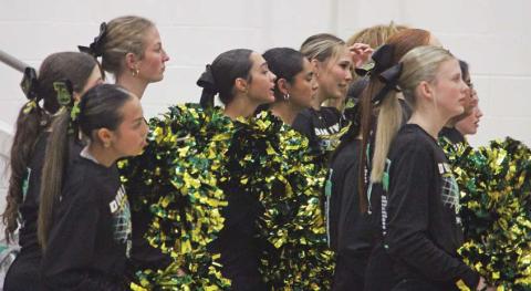 Dublin cheerleaders watch the Wednesday, Feb. 19 playoff game between the Lions and City View from the Mineral Wells stands where they kept the crowd cheering. Below, head coach Wes Grisham maps out a play for the Lions during time out while senior Kaden Gaitan takes advantage of an undefended basket to add two points. Paul Gaudette | Citizen staff photos