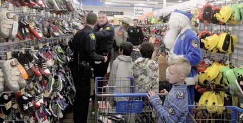 Dublin Police Chief Cameron Ray helps other law enforcement officers choose shoes for kids they are helping shop with at the 5th annual Erath County Shop with a Cop, Thursday, Dec. 19. The annual event provides Erath County kids $250 to shop with at the Stephenville Walmart and they are paired with area law enforcement personnel. For more photos see the Dublin Citizen Facebook page. Paul Gaudette | Citizen staff photo