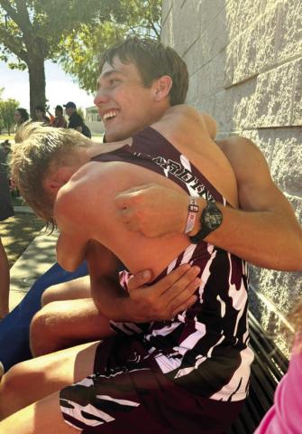 Lingleville cross country runners Jacob Koke and Garrett Hurt hug at the regional meet Oct. 20 in Arlington. The duo both qualified to compete at the state competition Oct. 31 in Round Rock. | Submitted photo
