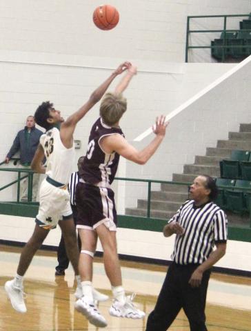 Dublin Lion Ayush Patel leaps to take control of the ball during the Nov. 15 home game against Brownwood where Dublin jumped to an early lead. Dalan Rasberry (below, right) goes airborne to slip past a would-be Brownwood blocker. Paul Gaudette | Citizen staff photos