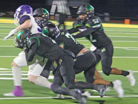 A host of Dublin Lions bring down an Early ballrunner in the Nov. 8 home game. Head football coach Greg Hardcastle credited the defense for holding the opposition at bay until the offense hit their stride and took control in the second half. Senior Night was also held. See page B6 for those photos. Paul Gaudette | Citizen staff photo