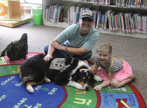 Annie and her handler Lyndi Hanna with Annie’s Therapeutic Companions greet young readers at the Dublin Public Library for Barks and Books. Participants are able to read aloud to dogs in a non-judgmental environment. The next Barks and Books will be held at 11 a.m. Saturday, Aug. 5 at the library. Paul Gaudette | Citizen staff photo