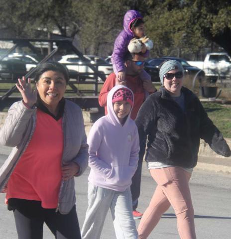 CWJC Site Director Juanita Brawley waves as she begins the annual fun run with the Love Run benefitting the CWJC/Transformation Pathway. For more photos see the Dublin Citizen Facebook page. Paul Gaudette | Citizen staff photo