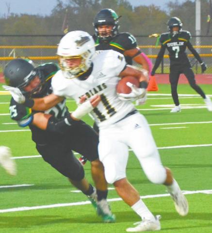 Dublin Lion Javier Parra ropes in a Comanche Indian advancing up the field during Friday night’s home game on the Bob &amp; Norma Cervetto Field. Both teams stopped the other from scoring the first quarter, but the game opened up by the end to 38-6 Dublin loss. Paul Gaudette | Citizen staff photo