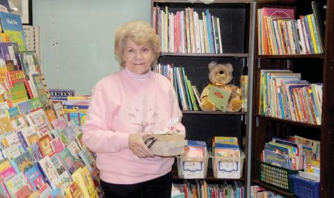 Gwen Osman, otherwise known as Mama Whoo, has spent hours organizing the book PageA4 sectionatCWJC-TransformationpathwaysinDublinasavolunteer. Wyndi Veigel | Citizen staff photo
