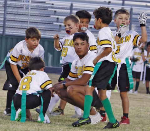 Tim Teten (above) crouches to coach kids in last fall’s Dublin Youth Football League and was assisted by his brother, Alex Teten (below), is a senior active in football, basketball and baseball. Paul Gaudette | Citizen staff photo