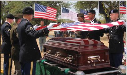 A flag is removed from the coffin of First Lt. Noel Shoup, a World War II veteran from Erath County, by the Honor Guard from Ft. Cavazos. Shoup’s remains were recently returned to his family after more than 79 years. Wyndi Veigel | Citizen staff photo