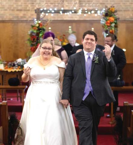Dublin Citizen editors Wyndi Veigel-Gaudette and Paul Gaudette struggle to keep rhythm and walk down the aisle during their wedding ceremony on Saturday, Oct. 28. Danielle Meador | submitted photo