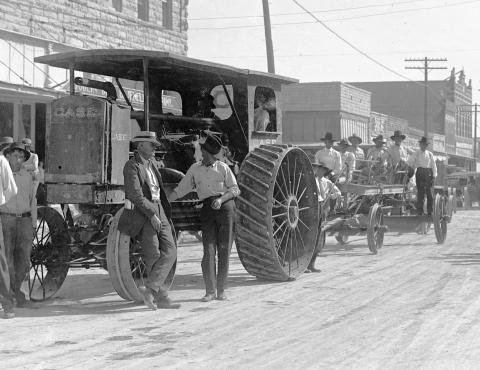   Courtesy photo This was the first mechanized equipment purchased by Erath County. Bud Salyer and L.W. Fulford are on the left, Bill Whitfield is seated in the cab and W.P. Hallmark is just behind the back wheel of the Case Tractor. John Lee Foster is at the steering wheel of the grader.