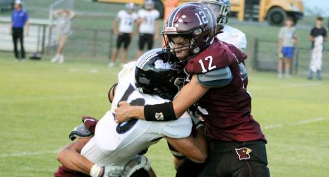 Paul Gaudette | Citizen staff photo Lingleville Cardinals Jorge Toledo and Izzy Juarez bring down a Union Hill ballrunner in Friday night’s game on the Lingleville field. The Cardinals sit at 2-1 for the season following the 46-0 loss.
