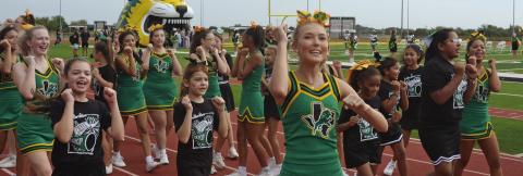 Dublin cheerleaders were joined by some spirited youngsters in the mini cheer camp at the Sept. 11 pep rally and game. Paul Gaudette | Citizen staff photo