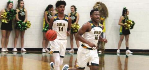 Dublin Lions Dalan Rasberry and Tyler Harrell move the ball down court during a recent home game. Paul Gaudette | Citizen staff photo