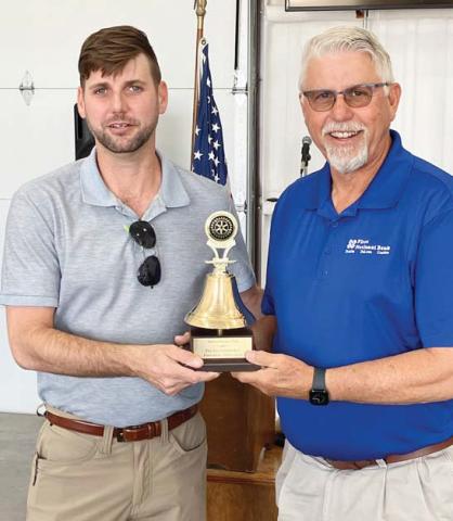 Lee Leatherwood (left) was announced as president of the Dublin Rotary Club for the coming year, taking the position held by his father, Pat (right). In recognition for his service as president, Pat was presented with a Rotary bell, recognizing his efforts in restoring the chapter bell when it was discovered a few years ago and need a missing piece. Karen Wright | Submitted photo
